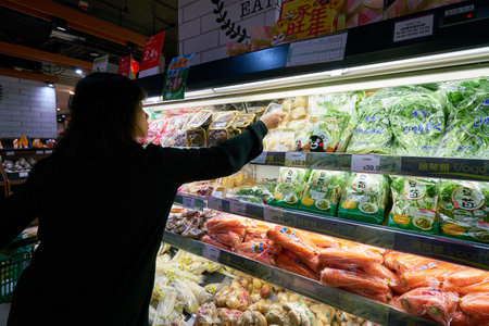 HONG KONG, CHINA - CIRCA FEBRUARY, 2019: consumer shopping for produce at AEON supermarket in Hong Kong.のeditorial素材