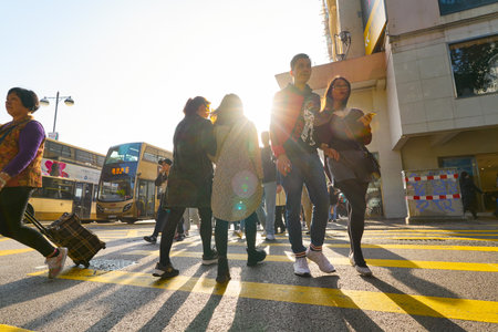 HONG KONG, CHINA - CIRCA FEBRUARY, 2019: diverse people crossing street in Hong Kong.のeditorial素材