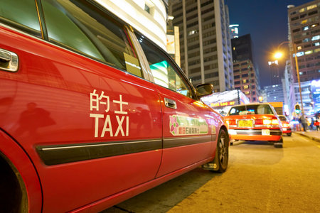 HONG KONG, CHINA - CIRCA JANUARY, 2019: close up shot of taxi in Hong Kong at night.のeditorial素材