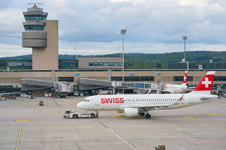 ZURICH, SWITZERLAND - CIRCA OCTOBER, 2018: Swiss aircraft on pushback at Zurich International Airport.のeditorial素材