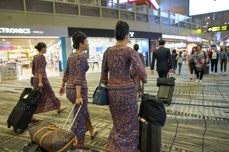 SINGAPORE - CIRCA APRIL, 2019: Singapore Airlines crew members seen at Changi International Airport.のeditorial素材