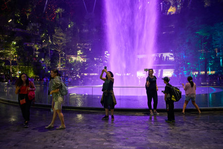 SINGAPORE - CIRCA APRIL, 2019: 40-meter HSBC Rain Vortex, the worldâs tallest indoor waterfall at the Jewel Changi Airport at night.のeditorial素材