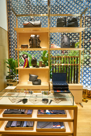 SINGAPORE - CIRCA APRIL, 2019: goods on display at Louis Vuitton store in Changi International Airport.のeditorial素材