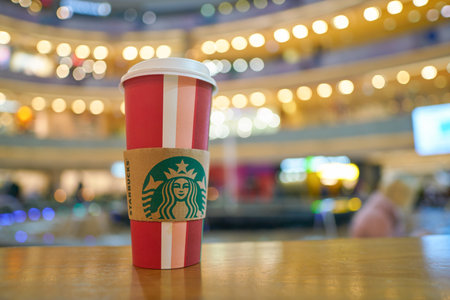 MOSCOW, RUSSIA - CIRCA OCTOBER, 2018: Starbucks paper cup on a table at Afimall in Moscow.のeditorial素材