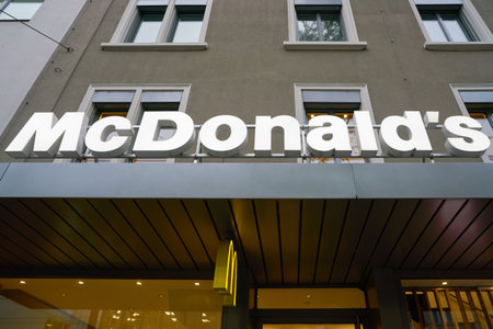 ZURICH, SWITZERLAND - CIRCA OCTOBER, 2018: McDonald's sign over a restaurant entrance in Zurich.