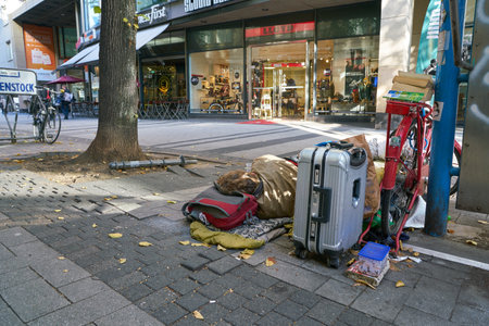COLOGNE, GERMANY - CIRCA OCTOBER, 2018: man sleep on a street in Cologne.のeditorial素材