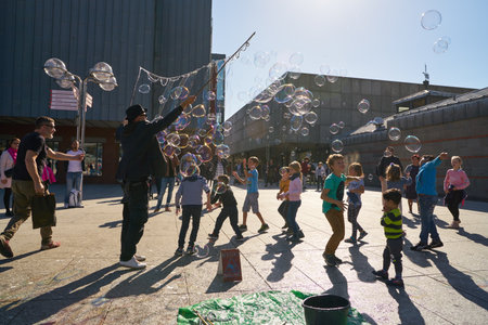 COLOGNE, GERMANY - CIRCA SEPTEMBER, 2019: street artist play with children in Cologne.のeditorial素材