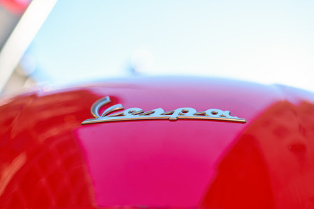 COLOGNE, GERMANY - CIRCA SEPTEMBER, 2018: close up shot of Vespa sign seen in Cologne. Vespa is an Italian brand of scooter manufactured by Piaggio.のeditorial素材