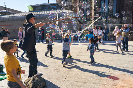 COLOGNE, GERMANY - CIRCA SEPTEMBER, 2019: street artist play with children in Cologne.のeditorial素材