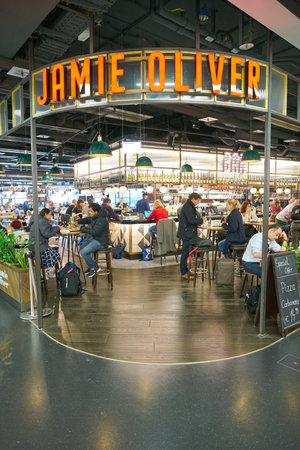 VIENNA, AUSTRIA - CIRCA MAY, 2019: people at Jamie Oliver in Vienna International Airport.のeditorial素材