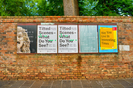 VENICE, ITALY - CIRCA MAY, 2019: posters seen on a brick wall in Venice.のeditorial素材