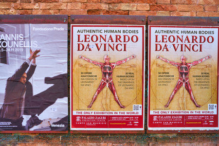 VENICE, ITALY - CIRCA MAY, 2019: posters seen on a brick wall in Venice.のeditorial素材