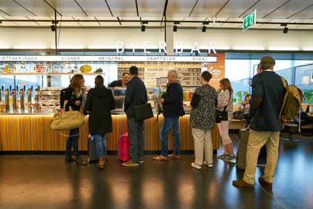 VIENNA, AUSTRIA - CIRCA MAY, 2019: people staying in queue at Vienna International Airport.