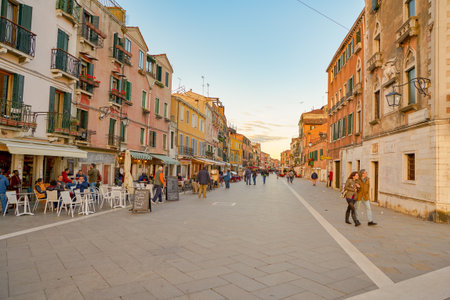 VENICE, ITALY - CIRCA MAY, 2019: view of a street with restaurants located in Venice.のeditorial素材