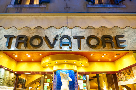 VENICE, ITALY - CIRCA MAY, 2019: Trovatore sign over a restaurant entrance in Venice.のeditorial素材