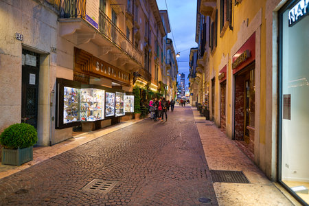 VERONA, ITALY - CIRCA MAY, 2019: a view of a street located in Verona in the evening.のeditorial素材