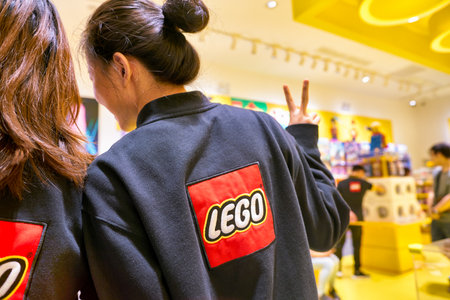 SHENZHEN, CHINA - APRIL 19, 2019: Lego sign on staff uniform at Lego store in Shenzhen. Lego is a...