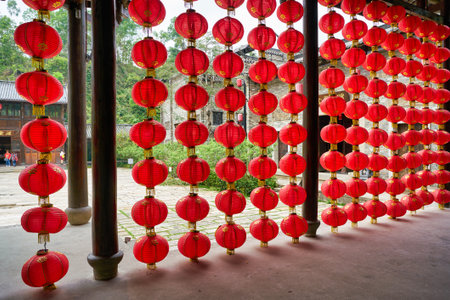 SHENZHEN, CHINA - CIRCA APRIL, 2019: Chinese lanterns decorate a building at Gankeng Hakka Town in Shenzhen. Gankeng Hakka Town is a tourist attraction by OCT Group.のeditorial素材