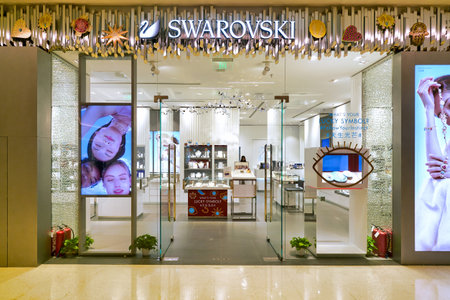 SHENZHEN, CHINA - APRIL 15, 2019: entrance to Swarovski store in MixC Shenzhen Bay shopping mall. Swarovski is an Austrian producer of crystal.のeditorial素材