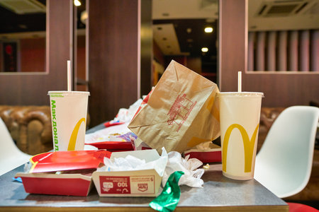 MOSCOW, RUSSIA - CIRCA JANUARY, 2019:  left food tray on a table at McDonald's restaurant in Moscow.のeditorial素材