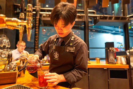 SHENZHEN, CHINA - CIRCA APRIL, 2019: barista prepare beverage at Starbucks Reserve Bar in Shenzhen....