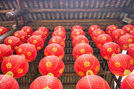 SHENZHEN, CHINA - CIRCA APRIL, 2019: Chinese lanterns decorate a building at Gankeng Hakka Town in Shenzhen. Gankeng Hakka Town is a tourist attraction by OCT Group.のeditorial素材
