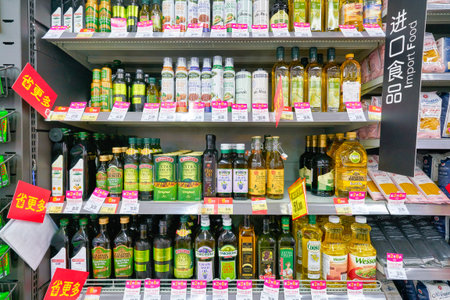 SHENZHEN, CHINA - CIRCA APRIL, 2019: bottles with oil on display at Carrefour Le Marche supermarket in Shenzhen.のeditorial素材