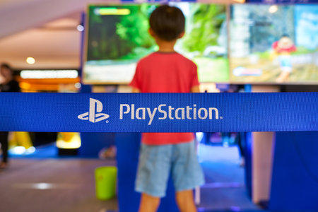 SHENZHEN, CHINA - APRIL 21, 2019: PlayStation sign on a belt at Sony Expo 2019 in UpperHills shopping mall.のeditorial素材