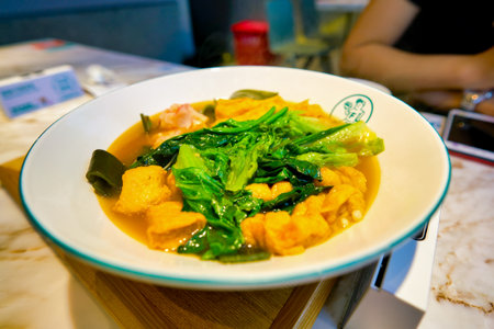 SHENZHEN, CHINA - CIRCA APRIL, 2019: close up shot of prepared dish at a restaurant in Shenzhen.