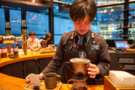 SHENZHEN, CHINA - CIRCA APRIL, 2019: barista prepare coffee at Starbucks Reserve Bar in Shenzhen....