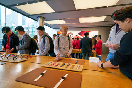 HONG KONG, CHINA - CIRCA JANUARY, 2019: people try Apple gadgets at Apple store in Hong Kong.
