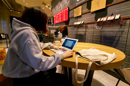 SHENZHEN, CHINA - CIRCA JANUARY  2019: woman sit at Starbucks in Shenzhen.