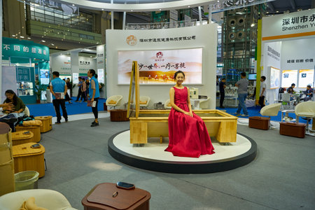 SHENZHEN, CHINA - CIRCA NOVEMBER, 2019: woman posing at China Hi-Tech Fair 2019 in Shenzhen Convention & Exhibition Center.のeditorial素材