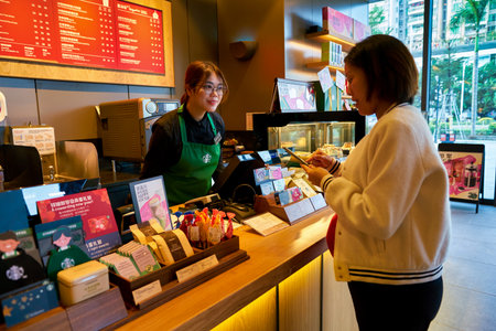 SHENZHEN, CHINA - CIRCA JANUARY  2019: woman buying coffee at Starbucks in Shenzhen.