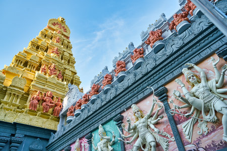 SINGAPORE - CIRCA APRIL, 2019: view of sculptures of god Shiva, dancing Sathura and Santhiya Thandavam as seen on the exterior facade of Sri Senpaga Vinayagar Temple.のeditorial素材