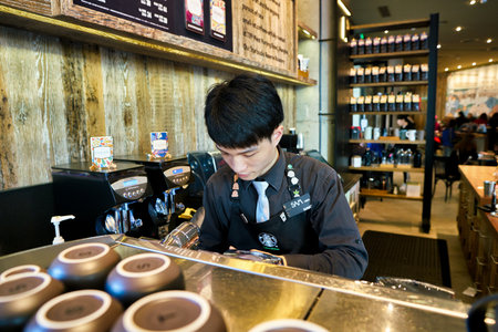 SHENZHEN, CHINA - CIRCA FEBRUARY,  2019: barista preparing coffee at Starbucks Reserve in Shenzhen.