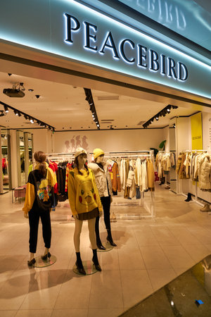 SHENZHEN, CHINA - CIRCA NOVEMBER, 2019: clothing on display at Peacebird store in Wongtee Plaza...