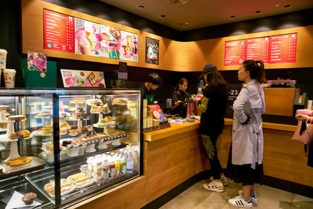 SHENZHEN, CHINA - CIRCA FEBRUARY,  2019: people are standing in line at Starbucks in Shenzhen.