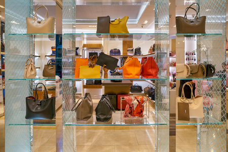 SINGAPORE - CIRCA APRIL, 2019: bags on display at Longchamp store in The Shoppes at Marina Bay Sands.のeditorial素材