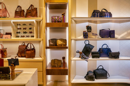 SINGAPORE - CIRCA APRIL, 2019: bags on display at Longchamp store in The Shoppes at Marina Bay Sands.のeditorial素材