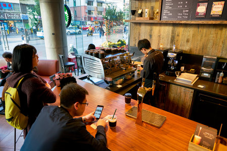 SHENZHEN, CHINA - CIRCA FEBRUARY,  2019: barista preparing coffee at Starbucks in Shenzhen.のeditorial素材