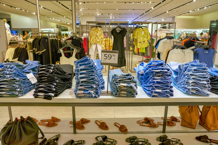 SINGAPORE - CIRCA APRIL, 2019: clothes on display at Zara store in the Shoppes at Marina Bay Sands.