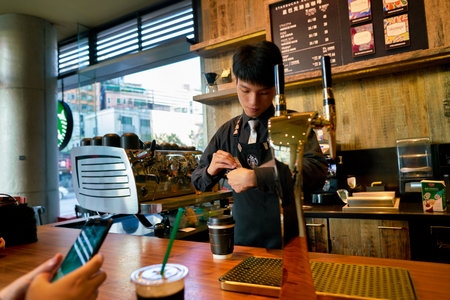 SHENZHEN, CHINA - CIRCA FEBRUARY,  2019: handsome barista working at Starbucks Reserve in Shenzhen.のeditorial素材