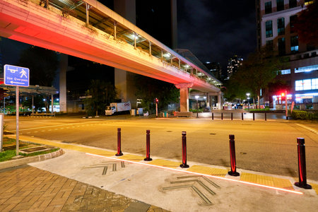 SINGAPORE - CIRCA APRIL, 2019: street level view of a road in Singapore at night.のeditorial素材