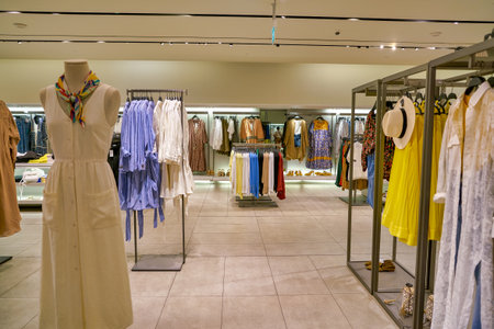 SINGAPORE - CIRCA APRIL, 2019: clothes on display at Zara store in the Shoppes at Marina Bay Sands.のeditorial素材