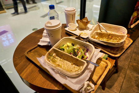 SHENZHEN, CHINA - CIRCA FEBRUARY,  2019: left food on trays at Starbucks in Shenzhen.のeditorial素材