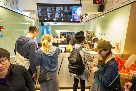 HONG KONG, CHINA - CIRCA JANUARY, 2019: young people are ordering drinks at a cafe in Hong Kong.