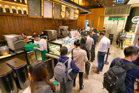 HONG KONG, CHINA - JANUARY 22, 2019: people queue at Starbucks Coffee at the IFC Mall in Hong Kong.のeditorial素材