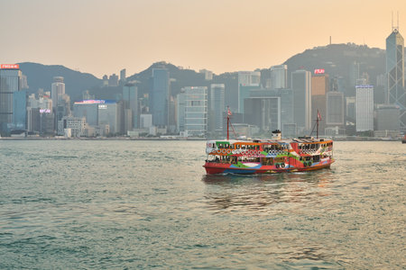 HONG KONG, CHINA - CIRCA JANUARY, 2019: a Star Ferry in Asia's World City livery crossing Victoria Harbour. The Star Ferry is a passenger ferry service operator and tourist attraction in Hong Kong.のeditorial素材