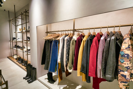 HONG KONG, CHINA - JANUARY 23, 2019: clothes on display at a store in New Town Plaza. New Town Plaza is a shopping mall in the town centre of Sha Tin, Hong Kong.のeditorial素材